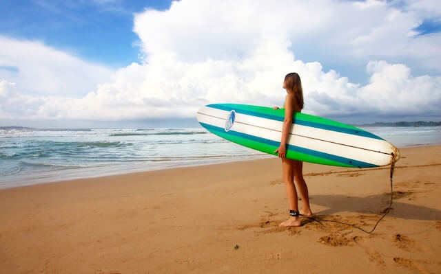 a woman ready to surf
